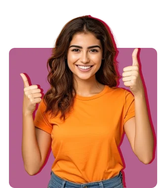 A smiling woman with wavy brown hair in an orange t-shirt and blue jeans gives two thumbs up against a solid magenta background.