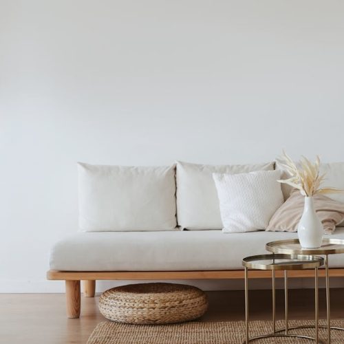 White Couch on Wooden Floor